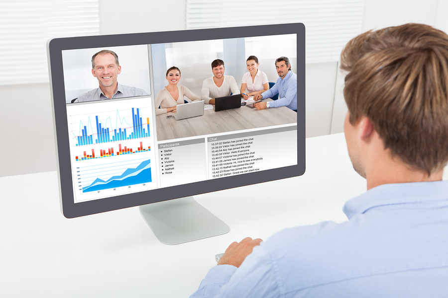 Businessman Video Conferencing On Computer How Video Conferencing in the Cloud Can Help Your Business