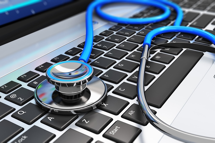 Stethoscope on laptop keyboard Four Ways the Healthcare Industry Benefits from Cloud Computing